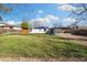 Expansive backyard showcasing fresh green grass and mature landscaping, ideal for outdoor living at 7320 W 21St Ave, Lakewood, CO 80214