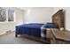 Bedroom with wooden bed frame, window, and gray carpet at 7320 W 21St Ave, Lakewood, CO 80214