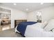 This cozy bedroom boasts access to an ensuite bathroom and comfortable living space at 7320 W 21St Ave, Lakewood, CO 80214