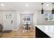 Bright dining area with hardwood floors, recessed lighting and modern pendant lights at 7320 W 21St Ave, Lakewood, CO 80214
