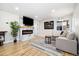 Bright living room featuring hardwood floors, marble fireplace, comfortable seating and an inviting view at 7320 W 21St Ave, Lakewood, CO 80214