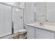 Modern bathroom features a tiled shower with glass doors, a stylish vanity, and a white ceramic toilet at 9153 Truckee Ct, Commerce City, CO 80022