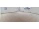 Large, carpeted bedroom with white walls, two large windows and plenty of natural light at 9153 Truckee Ct, Commerce City, CO 80022