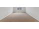 Neutral bedroom with light-colored carpet, white walls, and a single window providing natural light at 9153 Truckee Ct, Commerce City, CO 80022