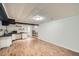 Finished basement with wooden floors, stylish shelving, and ample counter space at 1740 S Estes St, Lakewood, CO 80232