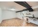 Basement features updated floors, shelves, lighting, and a kitchenette at 1740 S Estes St, Lakewood, CO 80232