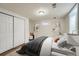 Basement bedroom with a queen bed, closet, and neutral decor at 1740 S Estes St, Lakewood, CO 80232