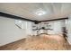 Finished basement includes updated floors, shelves, lighting, and a kitchenette at 1740 S Estes St, Lakewood, CO 80232