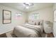 Bedroom featuring a queen bed, neutral tones, and natural light at 1740 S Estes St, Lakewood, CO 80232