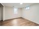 Bedroom features updated floors and dual windows at 1740 S Estes St, Lakewood, CO 80232