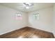 Cozy bedroom with hardwood floors, natural light, and a ceiling fan at 1740 S Estes St, Lakewood, CO 80232