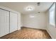 Bedroom features updated floors, a closet, and a window at 1740 S Estes St, Lakewood, CO 80232