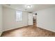 Bedroom features updated floors and a window at 1740 S Estes St, Lakewood, CO 80232