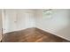 Bedroom features hardwood floors, a window, and a closet at 1740 S Estes St, Lakewood, CO 80232