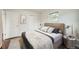 Bedroom with a queen bed, modern decor, a window, and closet space at 1740 S Estes St, Lakewood, CO 80232