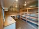 View of unfinished storage space with built-in shelving, perfect for organization at 1740 S Estes St, Lakewood, CO 80232