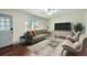 Bright living room with modern furniture, hardwood floors, and lots of natural light at 1740 S Estes St, Lakewood, CO 80232