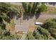 Aerial view showcases the home's location surrounded by trees and a long driveway at 649 Cottonwood Dr, Evergreen, CO 80439