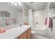 Inviting bathroom features a vanity with ample counter space and a well-maintained shower-tub combo for comfort at 649 Cottonwood Dr, Evergreen, CO 80439