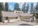 Charming single-Gathering home with a two-car garage and a well-maintained lawn surrounded by mature trees at 649 Cottonwood Dr, Evergreen, CO 80439
