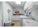 Functional laundry room equipped with a washer, dryer, and ample storage space at 649 Cottonwood Dr, Evergreen, CO 80439