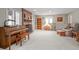 Inviting living room featuring a brick fireplace, piano, and cozy seating area at 649 Cottonwood Dr, Evergreen, CO 80439