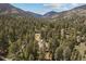 Overhead view of a wooded area with a home, located in the mountains with a view of the surrounding valley at 649 Cottonwood Dr, Evergreen, CO 80439