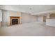 Spacious basement with a fireplace, recessed lighting, and plenty of room for entertaining at 7852 S Addison Way, Aurora, CO 80016
