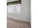 This bedroom boasts a window with blinds and neutral carpet providing a peaceful atmosphere at 7852 S Addison Way, Aurora, CO 80016