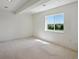 This bedroom features a window with a view, neutral carpet, and recessed lighting creating a blank canvas at 7852 S Addison Way, Aurora, CO 80016