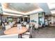 Upscale dining room with stylish decor, comfortable seating, and a modern fireplace at 7852 S Addison Way, Aurora, CO 80016