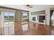 Inviting living room featuring fireplace, hardwood floors, and a sliding glass door to balcony at 7852 S Addison Way, Aurora, CO 80016