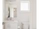 Contemporary bathroom with a sleek vanity, mirror, and modern fixtures for a clean look at 2321 S Acoma St, Denver, CO 80223