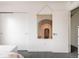 Bedroom featuring rainbow art, closet, and white walls with modern decor at 2321 S Acoma St, Denver, CO 80223