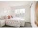 Bedroom featuring rainbow themed decor, white walls, and a sunny window view at 2321 S Acoma St, Denver, CO 80223