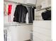 Walk-in closet with clothing rack, shelves, and storage for organized apparel at 2321 S Acoma St, Denver, CO 80223