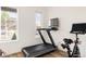 Bright home gym featuring modern exercise equipment and natural light from multiple windows at 2321 S Acoma St, Denver, CO 80223