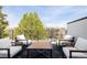 Inviting outdoor patio with comfortable seating and a table for relaxing and entertaining at 2321 S Acoma St, Denver, CO 80223