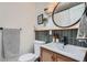 Well-lit bathroom features a unique vanity and fixtures and decorative hanging plants for added elegance at 7491 W 45Th Ave, Wheat Ridge, CO 80033
