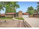 Charming single-story home with brick facade, manicured lawn, and a welcoming entrance at 7491 W 45Th Ave, Wheat Ridge, CO 80033