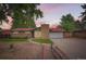 Charming single-story home with brick facade, manicured lawn, and a welcoming entrance at 7491 W 45Th Ave, Wheat Ridge, CO 80033