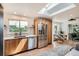 Bright kitchen featuring modern appliances, wood cabinetry, and a skylight for abundant natural light at 7491 W 45Th Ave, Wheat Ridge, CO 80033