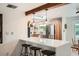 Bright kitchen with an island, wood cabinetry, a skylight and stainless steel appliances at 7491 W 45Th Ave, Wheat Ridge, CO 80033