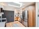 Modern kitchen featuring stainless steel appliances, sleek cabinetry, and a skylight at 7491 W 45Th Ave, Wheat Ridge, CO 80033