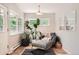 Cozy mud room with natural light, a comfortable chair, and easy access to the outdoors at 7491 W 45Th Ave, Wheat Ridge, CO 80033