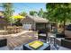 Inviting backyard deck with outdoor dining furniture and a comfortable seating arrangement at 3943 Newton St, Denver, CO 80211