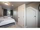 Cozy bedroom with neutral tones, white bedding, and ample natural light from a window at 3943 Newton St, Denver, CO 80211