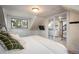 Comfortable bedroom features a large window and a sliding door closet at 3943 Newton St, Denver, CO 80211