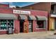 Inviting book bar featuring a vibrant red brick facade and cozy windows at 3943 Newton St, Denver, CO 80211