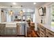 Open concept kitchen with a large island, stainless steel appliances and a view to the living area at 3943 Newton St, Denver, CO 80211